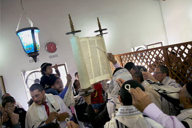 A Jewish congregation gathers round their Torah, a 120 year old scroll written in Amsterdam and obtained by the community five years ago. They belong to a community, one of many worldwide, of so-calle...