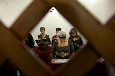 Women recite prayers in a synagogue. They belong to a community, one of many worldwide, of so-called 'lost Jews'. These communities, often previously Christians, claim a historic link with Judaism and...