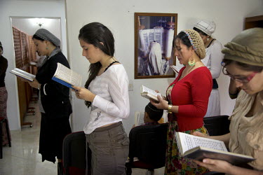 Women recite prayers in a synagogue. They belong to a community, one of many worldwide, of so-called 'lost Jews'. These communities, often previously Christians, claim a historic link with Judaism and...