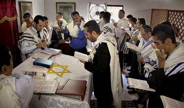 Men pray during a service in a synagogue. They belong to a community, one of many worldwide, of so-called 'lost Jews'. These communities, often previously Christians, claim a historic link with Judais...