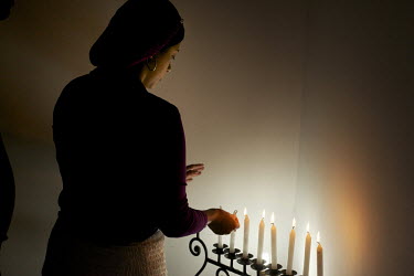 Galit Zapata lights candles in a Menorah at her home to mark the beginning of the Sabbath. Her family belong to a community, one of many worldwide, of so-called 'lost Jews'. These communities, often p...