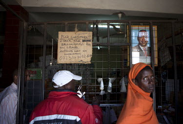 People queue at a small shop owned by Abdullahi Buko in the town of Isiolo, near the Lewa Wildlife Conservancy. Many believe that these shops are fronts for ivory and rhino horn trading.The Lewa Wildl...