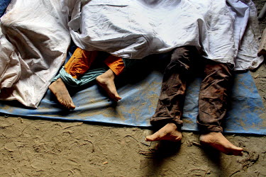 The feet of some of the hundreds of casualties from the collapse of the Rana Plaza complex in Savar on the outskirts of Dhaka. The 8 storey Rana Plaza complex, which housed a number of garment factori...