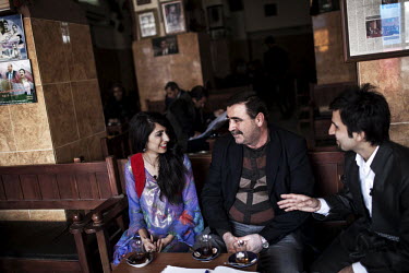A family sit in a Machko cafe in central Erbil.