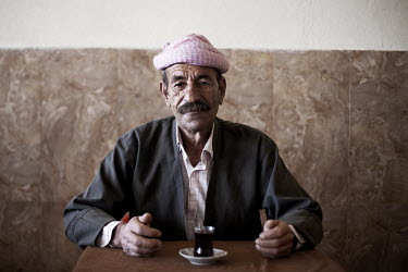 A Yazidi man in a traditional cafe. The Yazidi are a Kurdish ethno religious group. They adhere to a branch of Yazdanism that blends elements of Mithraism, pre-Islamic Mesopotamian religious tradition...