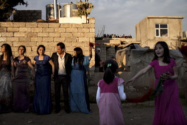 Young women dance on the street.The Yazidi are a Kurdish ethno religious group whom they live in northern Iraq, Syria, Armenia, south east of Turkey and Transcaucasia. They adhere to a branch of Yazda...