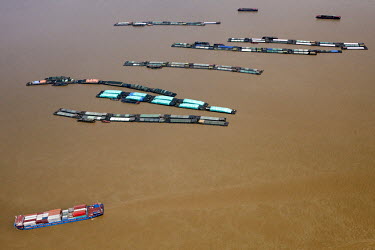 Fishing barges and container ships on the Yangtze River.