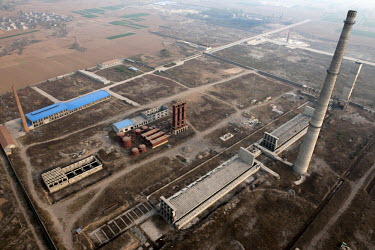 An industrial area with factories and chimneys in Linzhou.