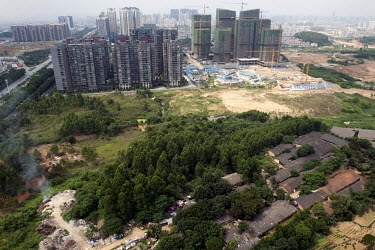 Old houses are gradually being cleared to make way for new residential complexes in the city of Nanning.