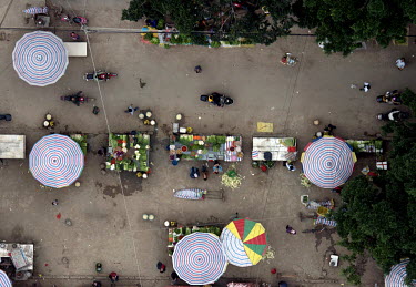 A fruit and vegetables market with colourful umbrellas in the area of Wuming near Nanning.