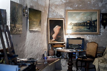 Paintings line the walls of an art gallery in Piran.