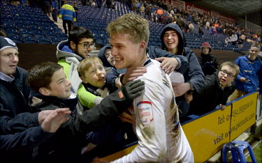 Preston North End football club fans congratulate 19 year old William Hayhurst following a 2 - 1 win against Oldham, played at the club's Deepdale stadium.  The football club was founded in 1863 and t...