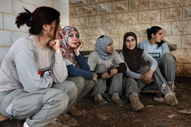 Five women deminers from the Mines Action Group's (MAG) Battle Area Clearance (BAC) team 3.