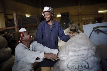 Women at work at the Ecopost factory, in an industrial area in Eastern Nairobi. EcoPost Ltd is a for profit social enterprise. They utilise waste plastic as a resource to manufacture aesthetic, durabl...