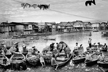 Men on boats transporting bananas in the Iquitos neighbourhood of Belen Bajo. They call it the Venice of the Rainforest, but the Iquitos quarter Belen Bajo has more edge to it than its Italian sister....