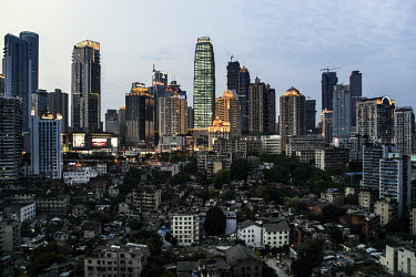 An overview of Chongqing city, one of the fastest-growing and biggest cities on earth, with a population of 29 million. The slum area under the high-rises is marked for demolition in the near future....