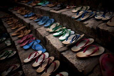 Slippers belonging to monks from the Myazeda Man Oo Monastery, where they produce promotional material and literature for the Buddhist nationalist 969 movement, are lined up outside the prayer hall wh...