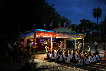 Villagers from Kyaw Min chant and pray as they wait for U Wirathu, the spiritual leader of the Buddhist nationalist 969 Movement, to give a sermon at the Shwe Areleain Monastery in Kyaw Min Village, M...