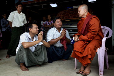 U Wirathu, the spiritual leader of the Buddhist nationalist 969 Movement, talks with supporters after a service in which he gave awards to young students at the Aye Thaka Monastery in Mandalay. U Wira...
