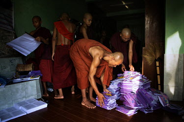 Monks from the Myazeda Man Oo Monastery, where they produce promotional material and literature for the Buddhist nationalist 969 movement, prepare pamphlets on a controversial new proposed marriage la...