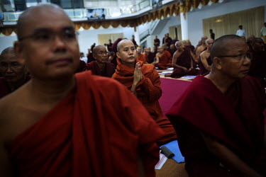 U Wirathu, the spiritual leader of the Buddhist nationalist '969' movement prays with other senior monks at a Buddhist conference on communal violence in Hmawbi, near Yangon (Rangoon). Wirathu was pus...