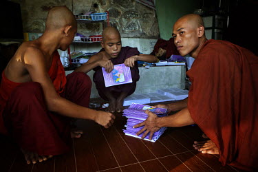 Monks from the Myazeda Man Oo Monastery, where they produce promotional material and literature for the Buddhist nationalist 969 movement, prepare pamphlets on a controversial new proposed marriage la...