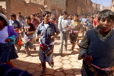 A community prepares to enter the plaza  of Macha during the <i>tinku</i> festival.   The people of Macha and surrounding communities carry on the pre-Columbian tradition of ritual fighting. The commu...