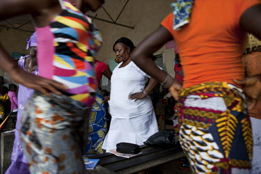 Midwife Zainab Manserray (white uniform) trains midwives at the Masougbo Chiefdom Primary Health Unit in Bombali District. Her work is supported by H4+ (made up of UNAIDS, UNFPA, UNICEF, UN Women, WHO...