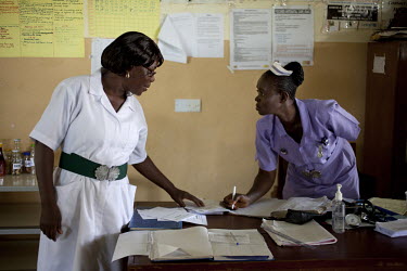 Sia Sandi (right), Student midwife from The School of Midwifery in Masuba, Makeni on placement at Makeni Regional Hospital. Her training is being funded by H4+. The H4+ (made up of UNAIDS, UNFPA, UNIC...