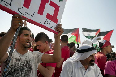 Bedouin youths protest against the 'Prawer Plan', near the unrecognised Bedouin village of El-Arakib. The Prawer Commission, chaired by Ehud Prawer, Benjamin Netanyahu's director of planning, was esta...