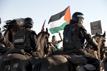 Mounted polic keep watch during a protest by Bedouin against the 'Prawer Plan', near the unrecognised Bedouin village of El-Arakib. The Prawer Commission, chaired by Ehud Prawer, Benjamin Netanyahu's...