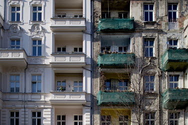 The old and new facades of an apartment blocks in the Prenzlauer Berg district.