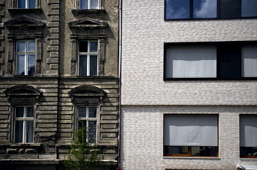 The old and new (the new one being the Choriner Hoefe building  by developers Diamona and Harnisch) facades of an apartment block in the Prenzlauer Berg district. Choriner Hoefe at the Zehdenicker Str...