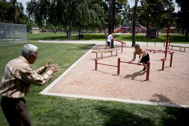 Antoun and Brett in a park in El Cajon, California. Antoun, 70, was a well-known weightlifting and boxing champion in Iraq in the 1970s. He's still in excellent physical condition. Since coming to the...