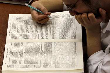 An Orthodox Jew studies a religous book at the 770 Eastern Parkway Chabad Synagogue.
