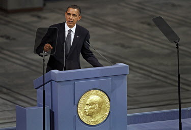 US President Barack Obama giving a speech after receiving the Nobel Peace Prize during a ceremony in Oslo Town Hall.