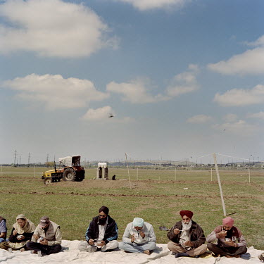 Sikhs eat food, after a service to celebrate Baisakhi, on the site of the first Sikh temple in Georgia. Baisakhi is one of the most important Sikh festivals, marking the first harvest of the year on t...
