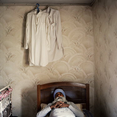 A relative of Indian farmer and landowner Ranjod Kamboj sleeps during the day at the house where the men live and work during the summer months. Georgia has seen its agricultural production drop in re...