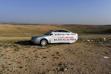 A car is draped in a banner which reads 'We Are All Al-Arakib' at 'Land Day' rally in the unrecognised Bedouin settlement of al Arakib (al Araqeeb) in Israel's southern Negev desert. 'Land Day' is an...