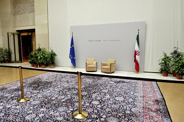 Two chairs are set up between the European Union and Iran flags at the Palais des Nations (United Nations) building in Geneva for the start of a second round of the E3 / EU+3 Iran talks. The E3 / EU +...