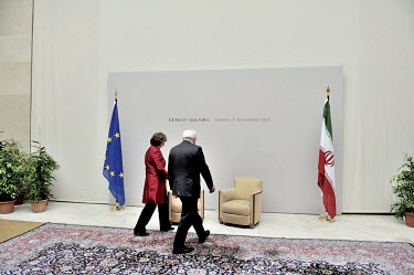Catherine Ashton, the European Union's High Representative for Foreign and Security Policy and Iranian Foreign Minister Mohammad Javad Zarif walk up to a pair of charis in the Palais des Nations (UN)...