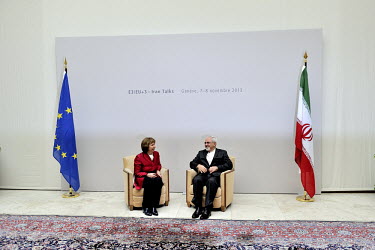 Catherine Ashton, the European Union's High Representative for Foreign and Security Policy and Iranian Foreign Minister Mohammad Javad Zarif sit on a pair of chairs in the Palais des Nations (UN) for...