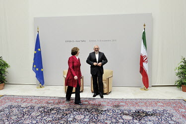 Catherine Ashton, the European Union's High Representative for Foreign and Security Policy and Iranian Foreign Minister Mohammad Javad Zarif walk away from a pair of chairs in the Palais des Nations (...
