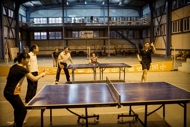 Chinese staff play table tennis at China House in Kitwe, this is a secure compound where all senior level employees at the NFCA's (Non-Ferrous Company Africa) Chambishi copper mine are accommodated. T...