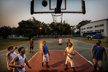 Chinese staff members play basket ball at China House in Kitwe, this is a secure compound where all senior level employees at the NFCA's (Non-Ferrous Company Africa) Chambishi copper mine are accommod...