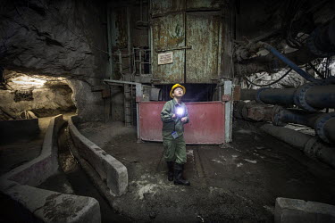 A Chinese supervisor in an underground pumping station at the NFCA's (Non-Ferrous Company Africa) Chambishi copper mine. All water is collected at this, the lowest point in the mine, before beinf pump...