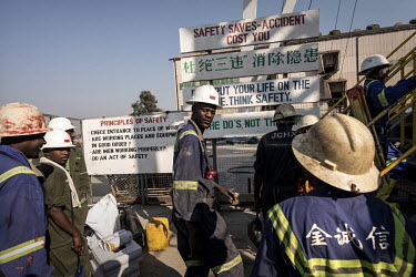 Miners enter the lift cage prior to going underground at the NFCA's (Non-Ferrous Company Africa) Chambishi copper mine. The NFCA, a Chinese company, owns and operates several mines and plants in the C...