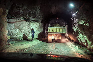 Trucks transporting copper ore from the excavation tunnel to the surface at the NFCA's (Non-Ferrous Company Africa) Chambishi copper mine. The NFCA, a Chinese company, owns and operates several mines...