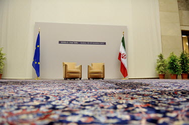 Two chairs and the flags of the European Union and Iran are set up at the Palais des Nations for a press pool at the start of the third, and ultimately successful, round of the E3/EU+3 Iran talks. The...