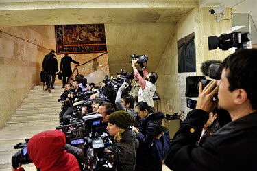 Members of the press pool at the entrance of the Palais des Nations cover the arrival of delagates for the the third, and ultimately successful, round of the E3/EU+3 Iran talks. The E3 / EU + 3 talks,...